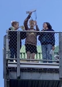 Students throwing parachutes